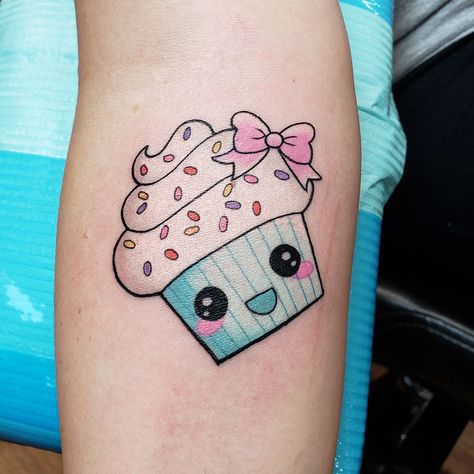 Cute little cupcake tattoo done by Doozer Soto #cupcaketattoo #cutetattoos #doozersototattoo #happylittlecupcake #sprinklescupcakes #iowatattoo #tagtheqc #quadcitiesiowa #midwesttattoo Cute Cupcake Tattoo, Cupcake Tattoo Designs Girly, Fine Line Cupcake Tattoo, Tiny Cupcake Tattoo, Sweets Tattoo Ideas, Muffin Tattoo, Cupcake Tattoo Designs, Dessert Tattoo, Kawaii Galaxy