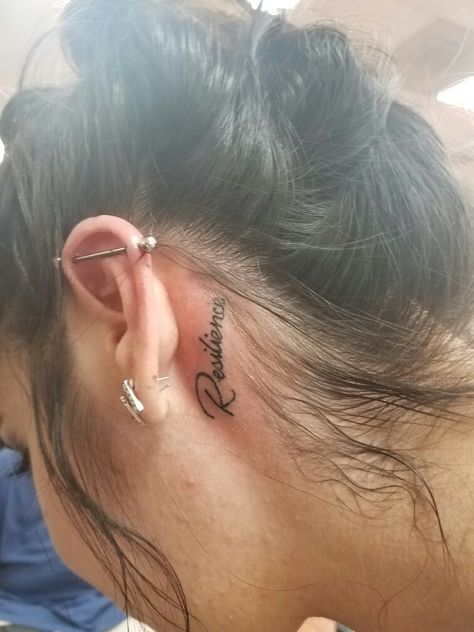 Ear Tattoo - Resilience: the capacity to recover quickly from difficulties; toughness. My 3rd tattoo. No pain behind the ear. Lol ❤ Cursive Tattoos Behind Ear, Resilience Tattoo Behind Ear, Side Of Ear Tattoo, Behind Ear Tats, Ear Tats, Resilience Tattoo, Face Tattoos For Women, Tattoo Behind Ear, Cursive Tattoos