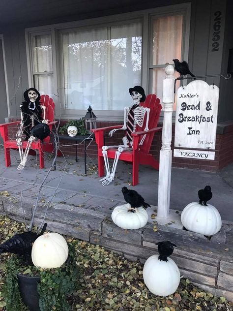 Halloween Porch Ideas Skeletons, Haunted Hotel Halloween Decorations, Adams Family Outdoor Decor, Skeleton Sitting In Chair Halloween, Haunted House Porch, Halloween Hotel Party, Dead And Breakfast Halloween, Haunted Hotel Party, Haunted Farm Ideas