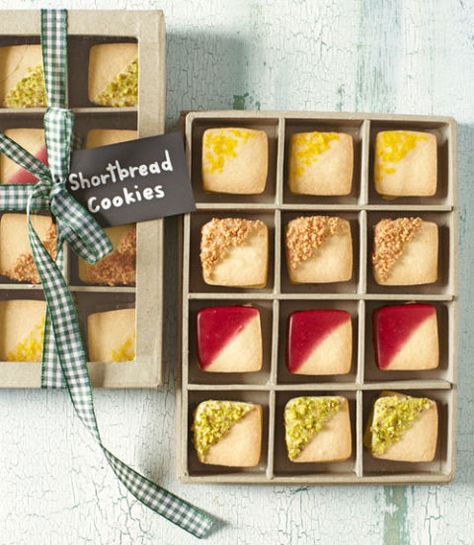 Displayed in a clear-topped checkerboard box, bite-size shortbread cookies—dipped in fruity glazes, chopped nuts, and citrus zest—pass for tiny works of art. Bonus: The sturdy container can later hold other petite treasures like jewelry or sewing notions. Recipe: Shortbread Cookies Edible Holiday Gifts, Homemade Food Gifts, Christmas Desserts Easy, Shortbread Cookie Recipe, Christmas Food Gifts, Edible Gifts, Shortbread Cookies, Cookies Recipes Christmas, Holiday Cookies