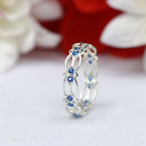 A unique Celtic ring set with beautiful blue Sapphire gemstones. Treat yourself to this handmade Celtic ring in sterling silver, Gold filled or Solid gold. Arrives gift ready, perfect as a stacking ring. ✦ Gemstone Type - Blue Sapphire corundum ✦ Gemstone Cut - Round cut ✦ Gemstone Size - 1.5mm ✦ Total Number of Gemstones - 16 ✦ Finish - 14k Gold Filled (Tarnish Resistant And Nickel Free) - also available in 925 sterling silver * For rings over size 11 please contact us for special pricing. * Cu Silver Celtic Rings, Ring Blue Sapphire, Pretty Engagement Rings, Celtic Ring, Saphir Ring, Cute Engagement Rings, Silver Ring Designs, Celtic Rings, Blue Sapphire Ring