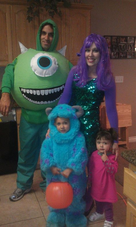 Last years Monsters Inc. family costume.. The Mike costume was made by putting paper mache on a yoga ball.. the horns, eye and mouth are made out of felt that had been stuffed with pillow stuffing. It was such a hit! Cecilia Monsters Inc Costume, Monsters Inc Family Of 4 Costume, Mike And Celia Costume, Celia Monsters Inc Costume, Celia Monsters Inc Costume Diy, Monster Inc Costume Family, Cute Mike And Sully Costumes, Monster Inc Costume Family Of 3, Monsters Inc Family Costume