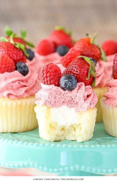 Berries and Cream Cupcakes - mixed berry buttercream paired with a moist vanilla cupcake stuffed with whipped cream cheese filling, topped with fresh strawberries, raspberries and blueberries | by Lindsay Conchar for TheCakeBlog.com Moist Vanilla Cupcakes, Cupcakes Vanilla, Berries And Cream, Moist Vanilla Cake, Cupcake Mix, Cream Cupcakes, Whipped Cream Cheese, Shower Cupcakes, Baby Shower Cupcakes