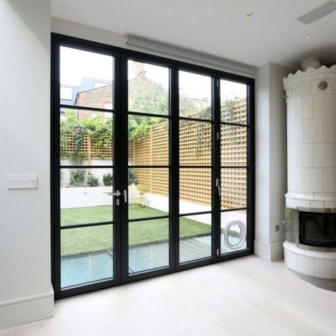 Steel Look Bifolding Doors | Mondrian® Glazing | Steel Industrial Style Glazing Bifold Doors Onto Patio, Crittal Doors, Bifold Patio Doors, Door Aesthetic, Modern Renovation, Sliding Patio Doors, Kitchen Extension, Aesthetic Ideas, Centre Piece