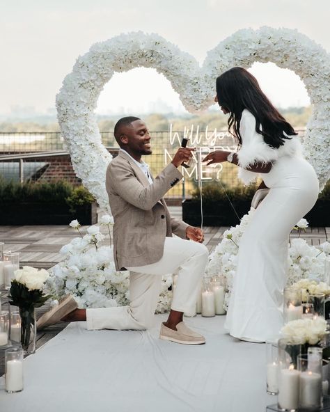 SHE SAID YES! 💍🤍🔐 Congratulations to this sweet couple! 🎉🎉🎉 . For our client, who traveled from the UK!?! We styled an all white proposal on a rooftop overlooking the city of Atlanta. The venue provided the perfect setting for this intimate proposal 🤍🤍🤍 . Proposal packages - link in bio. . Planner & Designer @brownsugahpicnics Marquee Letters @fantasy_fabulousatl Cold Sparklers @ansar_violin Photography @cassieraedsgn Music @salvationsax Venue @poncecityroof . . . . *****When sharing/using ou... All White Proposal, Black Couple Proposal, Atlanta Proposal, White Proposal, Cold Sparklers, Intimate Proposal, Matthew 19 6, Violin Photography, Proposal Photos