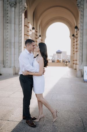 man and woman dressed in black and white, standing in front of Rice University Places To Get Engaged, Engagement Photos Houston, Engagement Props, Down On One Knee, Get Engaged, Rice University, Proposal Photography, Houston Photography, Houston Wedding Photographer