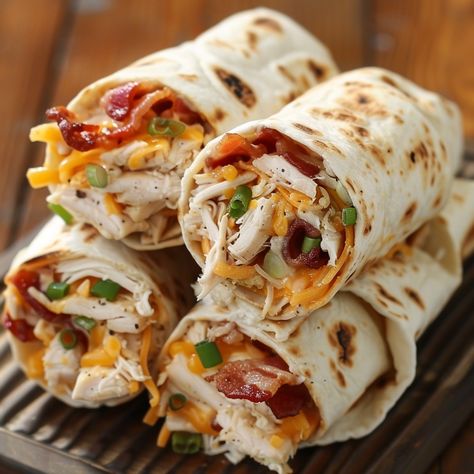 🥓 Try these Chicken Bacon Ranch Roll-Ups for a quick and delicious meal! 🐔🥓 #EasyMeals #ChickenRecipes Chicken Bacon Ranch Roll-Ups Ingredients: Flour tortillas (4) Cooked chicken, shredded (2 cups) Bacon, cooked and crumbled (8 slices) Ranch dressing (1/2 cup) Shredded cheddar cheese (1 cup) Green onions, chopped (1/4 cup) Instructions: Spread ranch dressing evenly on each tortilla. Layer chicken, bacon, cheese, and green onions on top. Roll up each tortilla tightly and slice into pinwhe... Sandwich Roll Ups, Meat Roll Ups, Chicken Bacon Cheese, Chicken Bacon Ranch Sandwich, Chicken Bacon Ranch Wrap, Chicken Shredded, Chicken Roll Ups, Layer Chicken, Tortilla Rolls