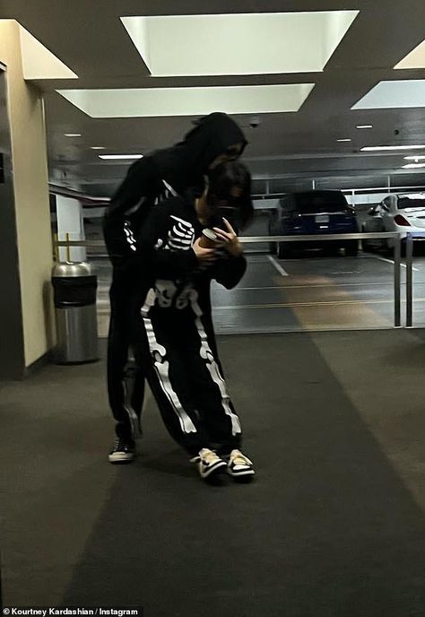 The 42-year-old reality television star cuddled up to her rockstar beau in their favorite matching skeleton onesies for a quick mirror selfie in an underground parking lot. Matching Skeleton Costumes, Couples Halloween Outfits Matching, Matching Onesies For Couples Halloween, Couple Skeleton Costume, Skeleton Couple Costume, Onesie Halloween Costumes, Couples Onesies, Skeleton Onesie, Underground Parking Lot