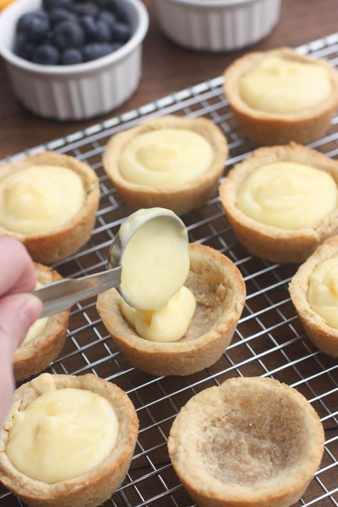 Creamy Lemon Sugar Cookie Cups - my favorite sugar cookie recipe baked in a muffin tin and filled with creamy lemon pie filling. Topped with fresh fruit. A beautiful and easy dessert that will impress your guests! Tartlet Recipes, Creamy Lemon Pie, Mini Muffin Tin Recipes, Lemon Sugar Cookie, Mini Tart Recipes, Mini Pie Recipes, Sugar Cookie Cups, Cookie Cups Recipe, Mini Dessert Recipes