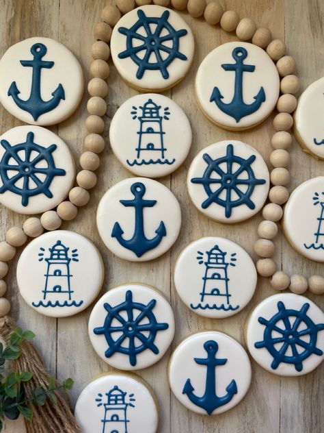 Royal Icing cookies. Hand piped lighthouse, ships wheel & anchor. Boating Cookies Decorated, Nautical Birthday Cookies, Nautical Theme Cookies, Sailboat Cookies Decorated, Nautical Cookies Decorated, Nautical Desserts, Crawfish Cookies, Cruise Cookies, Lighthouse Cookies