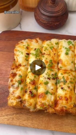 2.7K views · 1.1K reactions | Extra Cheesy Garlic Bread Recipe😍
Save the recipe to try later❤️

🎥:-@aarvidas

Ingredients :-
Garlic Cloves - 15
Oil - 2tbsp
Coriander Leaves
Butter
Chilli Flakes & Oregano
Ladi Pav -half cut
Mozzarella Cheese
Chilli Oil

#garlicbread #garlicbutter #garlicbreadrecipe #snacks #eveningsnacks #easyrecipes #viralvideos #explorepage #cheese #reels #trending #cheesegarlicbread #quickrecipes #streetfood | Foodi Hunger | Kawtar · Ya Lalali (Acapella) Cheesy Garlic Bread Recipe, Chilli Oil, Garlic Cheese Bread, Garlic Bread Recipe, Cheesy Garlic Bread, Evening Snacks, Chilli Flakes, Coriander Leaves, Garlic Butter