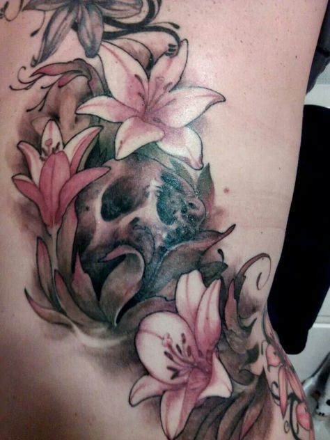 This almost looks like the skull tattoo I want, but lot quite. Lotus And Skull Tattoo, Skull Lilly Tattoo, Skull And Hibiscus Tattoo, Skull Lotus Tattoo, Skull With Lillies Tattoo, Tiger Lily Tattoos, Ocean Sleeve Tattoos, Skull Tattoo Flowers, Lillies Tattoo