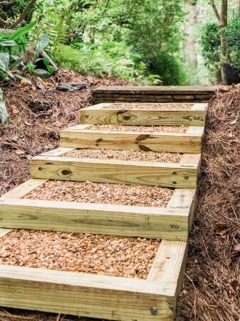 How to Build Outdoor Wood Steps | HGTV Timber Steps On Slope, Outdoor Staircase, Diy Steps, Building A Retaining Wall, Frame Placement, Gravel Landscaping, Wood Steps, Pressure Treated Wood, Pea Gravel