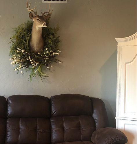 Added a wreath to husband’s deer head #deermount #husbandsdeerhead #taxidermy #wreath #deermountwithwreath #deermountdecor #deerheaddecor Wreath Around Deer Mount, Gallery Wall With Deer Mount, Deer Head Above Fireplace, Tasteful Taxidermy Decor, Decorating With Taxidermy, Dear Head Decor, Deer Mount Wall Arrangement, Mounted Deer Head Decor, Deer Head Decor Living Room Farmhouse