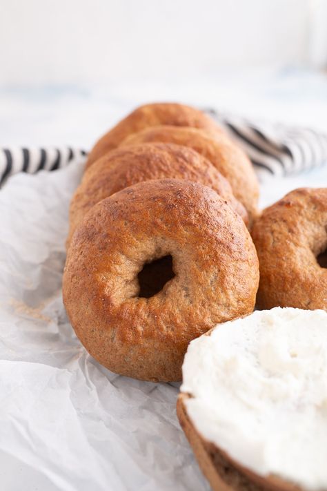 Homemade whole wheat bagels stacked horizontally on each other. One is cut in half and topped with cream cheese. Whole Wheat Bagel Recipe, Wheat Bagel Recipe, Best Bagel Recipe, Whole Wheat Bagels, Homemade Bagel Recipe, How To Make Bagels, Healthy Bagel, Gerd Recipes, Bagel Recipe Easy