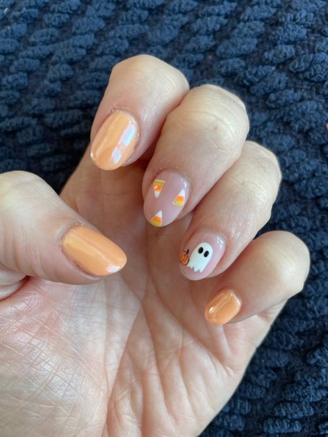 Orange chrome, candy corn and ghost! Candy Corn Nails Short, Ghost Chrome Nails, Cute Fall Nail Inspo Short, Cute November Nail Ideas, Orange Nails With Ghost, Candy Corn Halloween Nails, Halloween Candy Corn Nails, Chrome Ghost Nails, Candy Corn Nail Art