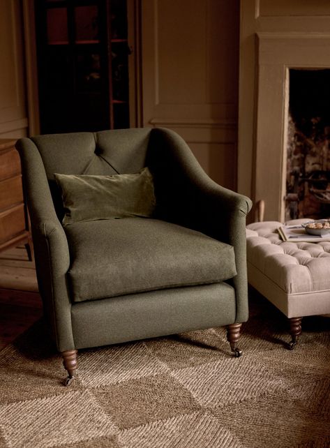 - A pared-down take on a Chesterfield armchair - Sustainably sourced hardwood frame – beech or birch depending on the season - Upholstered in a cosy, muted green wool - Just a few, thoughtfully placed buttons and diamond pleating - Neatly scrolled arms, also with a couple of pleats for detail - A foam cushion with a feather jacket for a deep, pillow-like seat - Turned oak legs set on brass castors - A sumptuous seat fit for good reads and fireside tipples Chesterfield Armchair, Good Reads, Bathroom Storage Solutions, Feather Jacket, Striped Upholstery, Grey Armchair, Armchair Furniture, Ticking Stripe, Oak Furniture