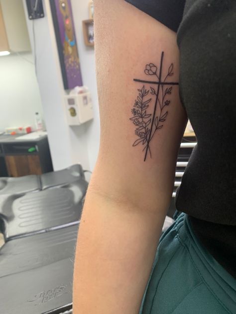 Cross And Floral Tattoo, Cross On Bicep Tattoo, Flower Western Tattoo, Bible Verse Flower Tattoo, Cross Tattoo Placement For Women, Cross Flowers Tattoo, Cross Forearm Tattoos For Women, Lower Arm Tattoos For Women Simple, Birth Flower Cross Tattoo