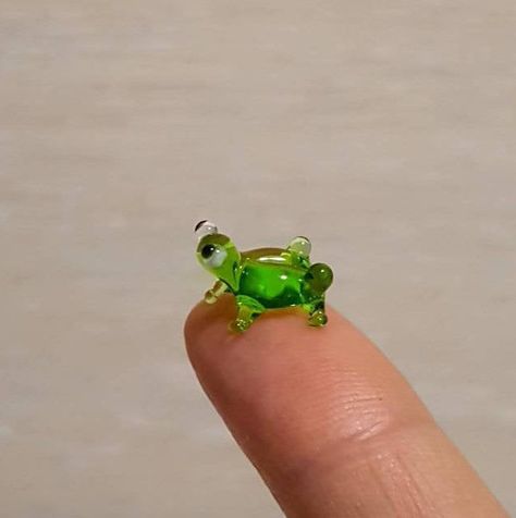 Cute minuscule glass frog. This is handmade murano glass figurines. They are just right for doll houses, fairy garden or your collection of mini animals. Also, great to be used as flower pot decoration as well. Tiny glass frogs are only 0.7 inch in size. Lampworking is a type of glasswork that uses a gas fueled torch to melt clear or colored glass rods. Glass in molten or to be correct in semi molten state is formed by shaping with tools and hand movements. We provide careful packaging so item w Glass Trinkets, Tiny Stuff, Tiny Figurines, Blown Glass Animals, Small Glass Animals, Glass Tree Frog, Miniature Glass Animals, Tiny Glass Figurines, Glass Figurines Animals