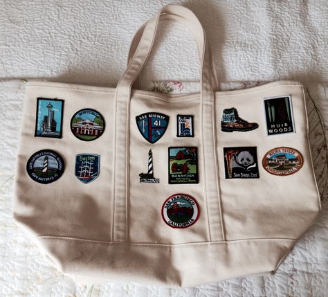 Beach house luggage:  my collection of travel patches on a big canvas bag. side 2 Travel Patches Blanket, Travel Patches Ideas, Canvas Bag With Patches, Bag Patches Aesthetic, Travel Patches Display Ideas, Travel Merch, Patch Blanket, Eco Bag Design, Patches Display