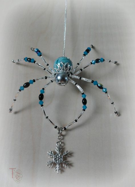 SOLD - I have many other beautiful spiders available in my shop, or I can make you one similar to Stormy; Christmas Spider Legend  Stormy is a gorgeous 4x4 inch beaded Christmas spider that shimmers and shines and cant wait to be part of your home décor. The blue and black crystals and beads are just like the blue skies that give way to dark clouds and the silver glass bugle beads on her legs shimmer brightly like flashes of lightening. She is holding a beautiful silver snowflake charm that c... Home Made Christmas Tree Decorations, Home Made Christmas Tree, Home Made Christmas, Spider Ornament, Diy Christmas Decorations For Home, Spider Crafts, Christmas Spider, Spider Jewelry, Beaded Spiders