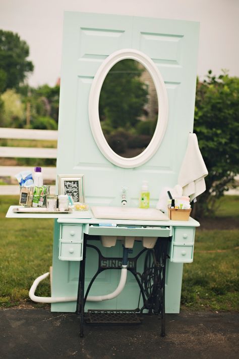 Outdoor hand washing station from vintage sewing machine.  Mount to door, add faucet that connects to garden hose, remove sewing machine and replace with small sink. Hand Washing Station Wedding, Outdoor Handwashing Station, Outdoor Wedding Handwashing Station, Outdoor Hand Washing Station, Portable Hand Washing Station Diy, Camping Hand Washing Station, Bathroom Sink Made From Old Sewing Machine, Outdoor Restroom, Wedding Restroom