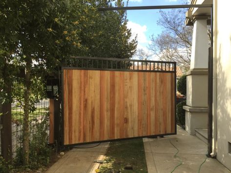 Driveway Gates: How Much Do They Cost? | Ultimate Guide Iron Gates Driveway, Custom Iron Gates, Wood Gates Driveway, Automatic Gates Driveways, Metal Driveway Gates, Iron Fences, Stair Well, Living Fence, Cosy House