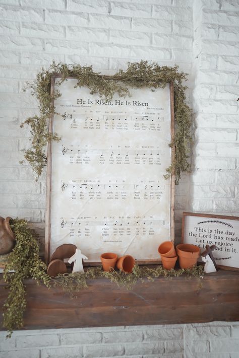 Christ centered Easter decor for mantle. He is risen sheet music DIY sign. Easy DIY sign for easter. DIY Christ cetnered Easter decor Lds Easter Decor, Diy Christian Easter Decor, Easy Spring Decor Diy, Easter Sunday Church Decoration Ideas, Resurrection Sunday Decorations, Cottage Easter Decor, Easter Decor Mantle, Resurrection Decorations, Spring Church Decorations