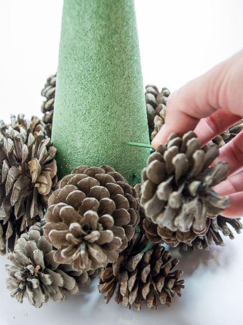 Turn Pine Cones Into a Tabletop Christmas Tree | HGTV Holiday Pine Cones, Pine Cone Tree, Small Pine Cones, Pine Cone Christmas Tree, Pine Cone Art, Christmas Pine Cones, Diy Pinecone, Cone Trees, Cone Christmas Trees