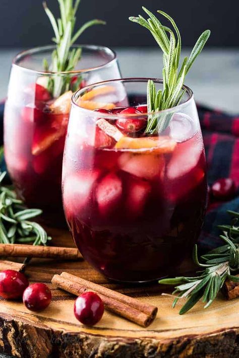 Our cranberry sangria is the perfect cocktail for the holiday season. Cranberry juice, wine, and spiced brandy create a tart and refreshing holiday drink! Holiday Sangria Recipes, Christmas Sangria Recipes, Sparkling Punch, Cranberry Sangria, Ladies Christmas Party, Buttercream Recipes, Holiday Sangria, Xmas Drinks, Christmas Sangria