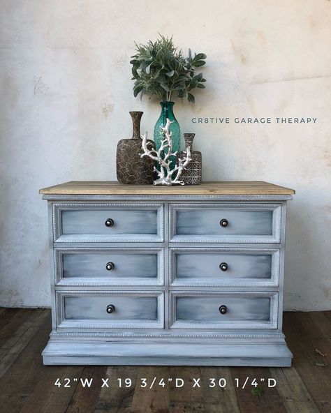 Coastal Inspired Dresser painted in lots of calming hues. I added planks to the top to continue the Beachy vibe. Available for local pick Painted in layers of #fusionmineralpaint #homestead blue #soapstone #sterling #dixiebellepaint #bestdangwax #grungegray #dresser #buffet #fixerupperinspired #fixerupper #chalkpaintedfurniture #beachy #layers #coastalliving #farmhousebuffet #entryhall #furnituremakeover #upcycledfurniture #paintinginlayers #interiordesign #blended #sandiego #poway #furniture # Beachy Layers, Fixer Upper Inspired, Farmhouse Buffet, Dresser Painted, Diy Room Decor Videos, Driftwood Art Diy, Dresser Furniture, Decor Videos, Beach Room