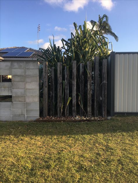 Staggered railway sleeper fence. Sleeper Fence Ideas, Railway Sleepers Fence, Sleeper Fence, Railway Sleeper Fence, Sleepers In Garden, Garden Fence Art, Railway Sleepers, Australia House, Timber Fencing