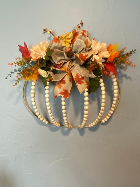 Unique wreathe created with a wire pumpkin frame and beading with Jute. A wired bow and florals added for a beautiful door hanger as well as a wall decoration. these wreathes will be lovely throughout fall and Thanksgiving. We now offer Local Pickup for all items!  If you're in the area, you can save on shipping and pick up your order directly from us. Simply  message before placing an order. Thank you Julia Lee 1945 Terry Ln De Pere WI   54115 julialee644@yahoo.com Color Variations:* Please not Pumpkin Reef, Wreath Ring Ideas, Diy Fall Crafts For Adults, Pumpkin Frame Wreath, Wire Pumpkin Wreath Diy, Beaded Wreaths, Wire Wreaths, Pumpkins Crafts, Julia Lee