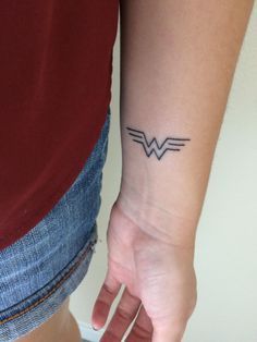 Minimalist simple Wonder Woman logo tattoo Woman Wrist Tattoo, Wonder Woman Tattoo, Animal Tattoos For Women, Minimalist Tattoo Meaning, Tattoo Catalog, Cool Wrist Tattoos, Woman Tattoo, Marvel Tattoos, Wonder Woman Logo