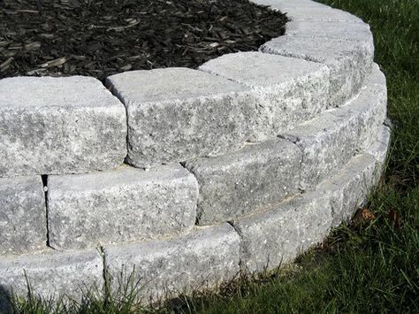 How to Build Raised Beds With Pavers | Hunker Beds Around Trees, Stone Flower Beds, Backyard Retaining Walls, Building A Retaining Wall, Building Raised Beds, Garden Retaining Wall, Raised Flower Beds, Stone Retaining Wall, Landscaping Retaining Walls