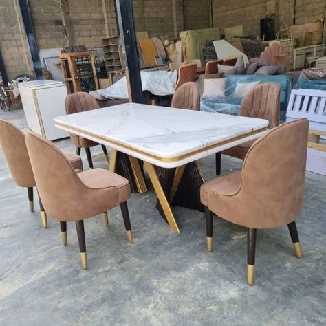 Indulge in luxury dining with our exquisite six-chair dining set and matching console mirror. The perfect blend of coffee brown, cream, gold, and marble tops ensures a stunning addition to your space. Elegant feather-like designed table legs in coffee brown and touches of gold accents make this set truly one-of-a-kind. . . . . . . . . . . . #LuxuryDining #ExquisiteDesign #FurnitureMakers #dining #consolemirror Brown Chairs Dining, Console Mirror, Table Design Modern, Dining Table Design Modern, Brown Dining Table, Unique Dining Tables, Table Foldable, Dining Table Gold, Marble Top Dining Table