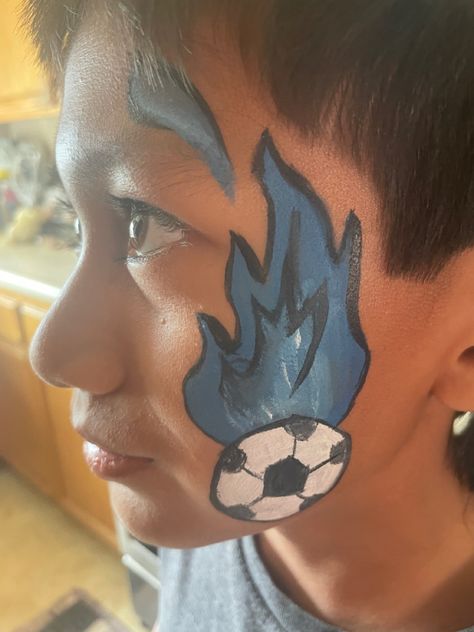 Easy kids face paint idea inspo footbal soccer blue fire Football Face Painting Ideas, Soccer Face Paint, Face Painting Dots Football, Ball Face Paint, Easy Kids Face Paint, Mexico Face Paint Soccer, World Cup Face Paint, Blue And White Face Paint Football, Face Painting Easy