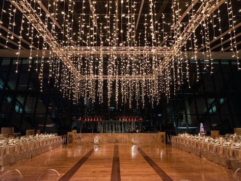 Waterfall Lights Wedding, Hanging Twinkle Lights Wedding, Fairy Lights Wedding Dance Floor, Wedding Dance Floor Fairy Lights, Wedding Decoration With Lights, Indoor Wedding Lights Ceilings, Wedding Ceiling Lights Indoor, Hanging Lights At Wedding, Indoor Hall Wedding Decor