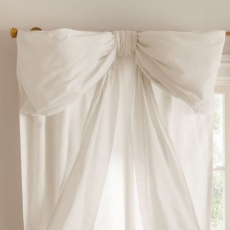 Durable construction meets sweet design in this blush-pink curtain. The oversized bow updates a classic silhouette and lends an enchanting aesthetic to their bedroom or nursery. Designed exclusively for Pottery Barn Teen by lifestyle brand LoveShackFancy. By choosing our cotton products, you're supporting our investment in Better Cotton's mission. This product is sourced via mass balance and therefore may not contain Better Cotton. Learn more at bettercotton.org/massbalance Made in a Fair Trade Certified(TM) factory, supporting fair and safe labor practices and empowering workers to invest in their communities. Workers receive extra funds for every product sold which are used for community projects chosen by workers. Woven of 55% linen and 45% cotton. Our curtain's 2-in-1 construction offe Curtain With Bows, Pottery Barn Love Shack Fancy, Feminine House Decor, Pottery Barn Girls Room, Bow Home Decor, Pink Toile Nursery, Preppy Curtains, Light Pink And White Bedroom, Cute Curtains Bedroom