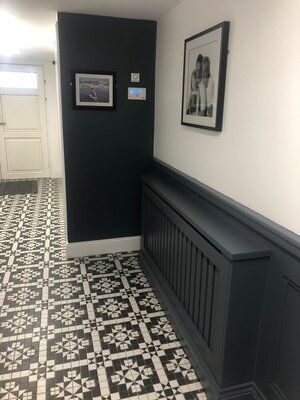 NH Interiors - #1 Wainscoting & Wall Panelling Installation Service in Dublin Covering Radiator Ideas, Panelled Wall With Radiator, Panelling With Radiator, Wall Panelling With Radiator Cover, Hallway Panelling With Radiator Cover, Dark Grey Half Wall Panelling Hallway, Half Wall Paneling Ideas Living Room, Black Hallway Radiator, Dado Rail Living Room