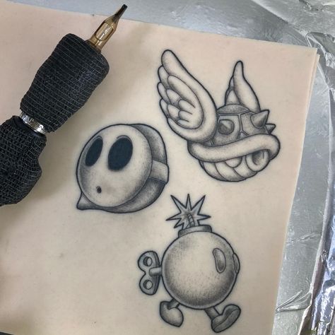 Mario Character Tattoos, Mario Theme Tattoo, Stippling Shading Tattoo, Bobomb Mario Tattoo, Small Shading Tattoo Design, Mario Flash Tattoo, Traditional Mario Tattoo, Mario Kart Tattoo Ideas, Stipple Shading Tattoo Design