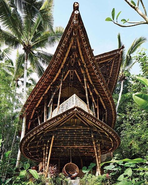 this all bamboo village in Bali is taking eco-tourism to the next level. | Photo Credit: Stephen Kent Johnson House In Bali, Bali Architecture, Eco House Design, Bamboo Building, Bamboo House Design, Bamboo Structure, Bamboo Architecture, Tree House Designs, Stunning Interior Design