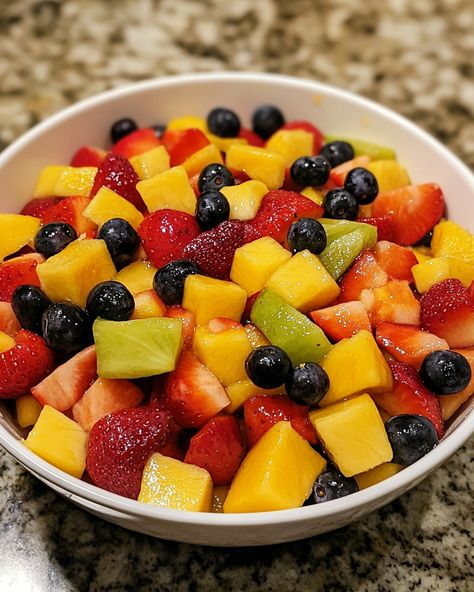 🍉 Classic Fruit Salad 🍓 A refreshing, vibrant mix of seasonal fruits that's perfect for any gathering or as a light, healthy snack! Ingredients: - 1 cup strawberries, hulled and sliced - 1 cup pineapple chunks - 1 cup grapes, halved - 1 cup watermelon, cubed - 2 kiwis, peeled and sliced - 2 bananas, sliced - 1 orange, peeled and segmented - 1 tablespoon honey (optional) - 1 tablespoon fresh lime juice Instructions: 1. In a large bowl, combine the strawberries, pineapple, grapes, ... Hawaiian Fruit, Watermelon Bowl, Healthy Fruit Salad, Holistic Health Nutrition, Pineapple Chunks, Meal Prep Snacks, Seasonal Fruits, Fresh Fruit Salad, Seasonal Fruit