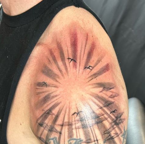 Mayhem Tattoo, Salem on Instagram: "Katie added some sun rays on shoulder  (other tattoo done by another artist)" Sun Ray Tattoo Design, Sunrays Tattoo Design, Sun Rays Tattoo Design, Ray Tattoo Design, Sun Ray Tattoo, Mayhem Tattoo, Rays Tattoo, Sun Rays Tattoo, Cloud Tattoo Design