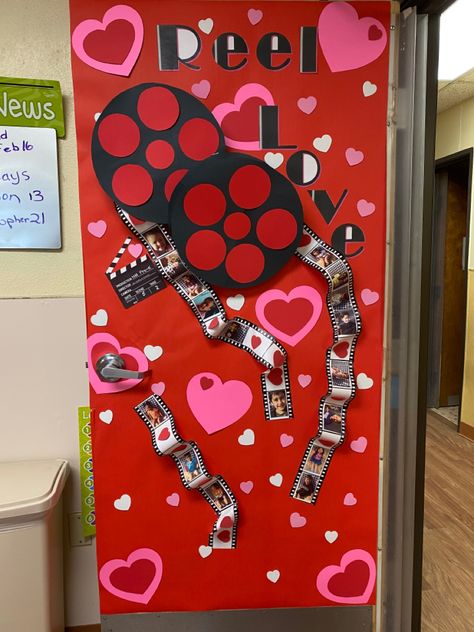 Getting the classroom ready for Valentine’s Day we decorated the door and the “film” for the reels has pictures of the kids Valentines Classroom Decorations, Valentines Door Decorations Classroom, Valentines Classroom Door, Valentine Bulletin Boards, Valentines Day Bulletin Board, Valentine Door Decorations, School Door Decorations, Door Decorating Contest, School Doors