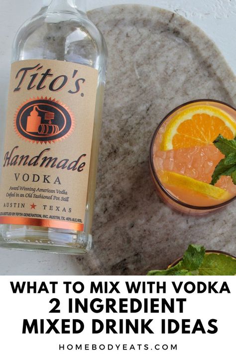 Tito's vodka bottle next to an orange flavored cocktail. Mix Drinks With Vodka, Best Vodka Mixed Drinks, 2 Ingredient Mixed Drinks, Cheap Alcoholic Drinks, What To Mix With Vodka, Low Calorie Vodka Cocktails, Drinks Low Calorie, Vodka Mixed Drinks Recipes, Low Calorie Options