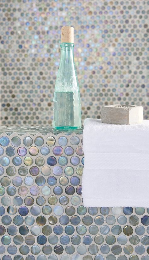 Tavo glass penny round mosaics provide a change from the standard square shape. These neutral iridescent mosaics take on colours in their surroundings, providing a serene feel that works well in coastal bathrooms. originalstyle.com Light Kitchen Floor, Bathroom Tower, Iridescent Mosaic, Shower Repair, Colour Pastel, Bath Tile, Small Bathroom Layout, Penny Round Mosaic, Round Mosaic