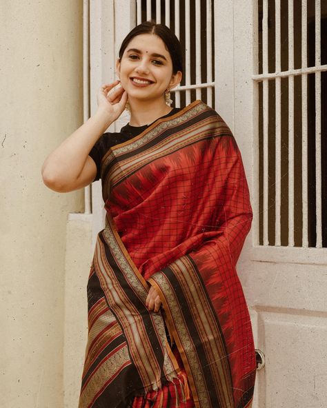 மல்லி In a Pattu pett saree Soft shades or vibrant hues might dominate the saree palette, reflecting the mood of a casual day. Patterns could include simple checks, stripes, or floral designs, adding a touch of charm without overwhelming the overall look. This stunning red Kanchipuram silk saree features a vibrant black silk border and a classic checkered pattern on the body. [Silk, Pattu Pet, Tulsi Weaves, silk saree, saree, silk, handloom saree, handloom, Traditional, Vintage, No Zari, K... Saree Silk, Saree Handloom, Kanchipuram Silk Saree, Checkered Pattern, Handloom Saree, Floral Designs, The Mood, Black Silk, Silk Saree