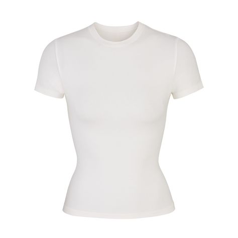 Find SKIMS Cotton Jersey T Shirt on Editorialist. Our viral t-shirt in the cotton everyone craves. This perfect five-star tee is made with our stretchy, lightweight cotton that enhances your curves with its body-hugging fit and elevates your comfort with its incredibly soft feel. Features stitching details along the short sleeves and hem and hits below the natural waist. Fits true to size. Armani Clothes, Jersey Tshirt, Mode Zara, Wardrobe Basics, 가을 패션, Girls Fashion, Dream Clothes, Jersey T Shirt, White T