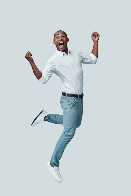 Man Jumping Pose, Happy Black Man, Jumping People, Success People, Christian Background Images, Man Jumping, Stock Photos People, Human Pictures, African Dance